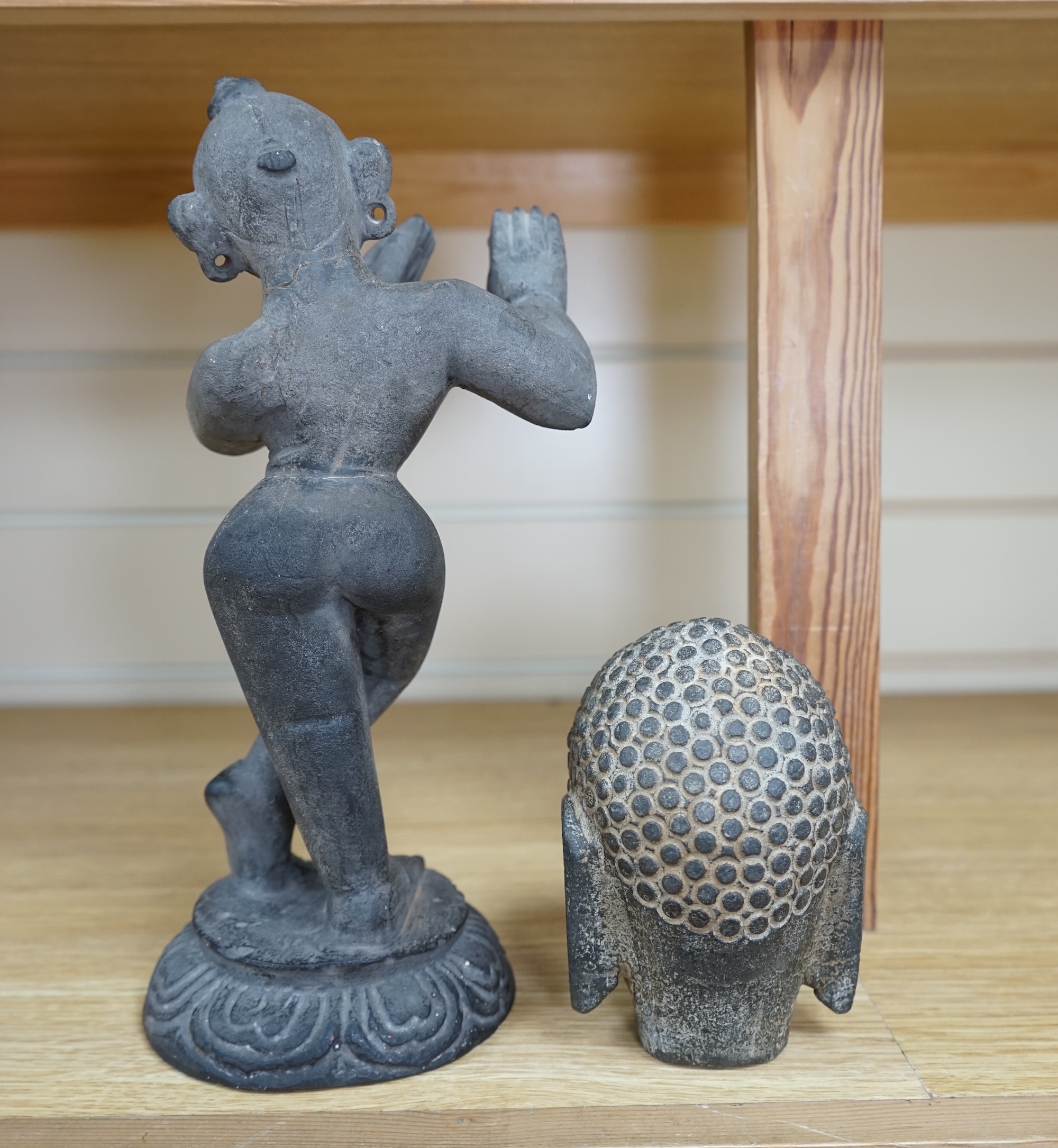 An Indian stone Buddha head and a figural carving, 29cm. Condition - figure repaired